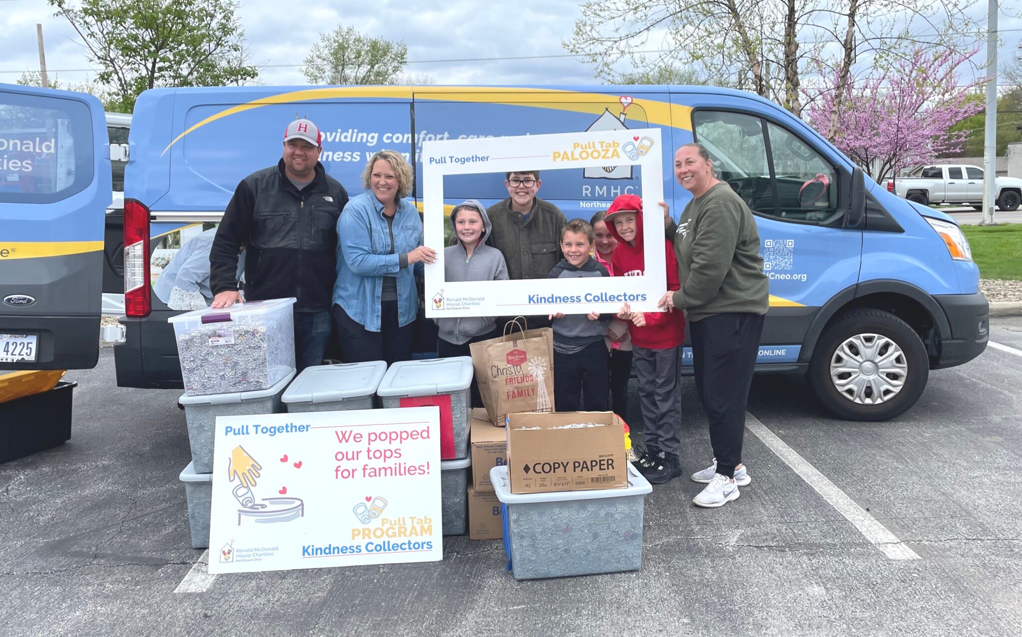 custom van and family, friends with selfie frames collecting kindness, donating pull tabs