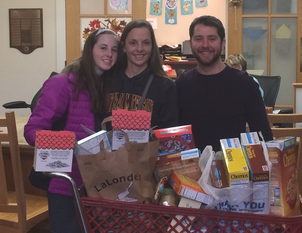 Family with cart of gifts