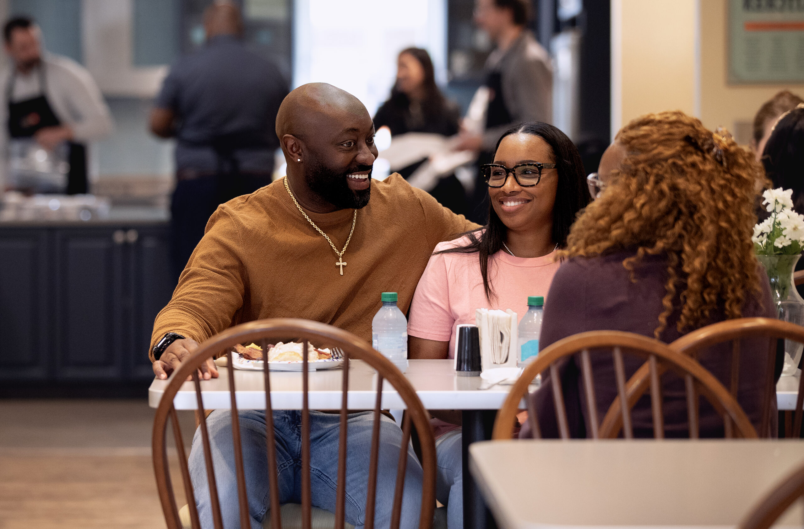 A couple share a meal at a table in the House dining room