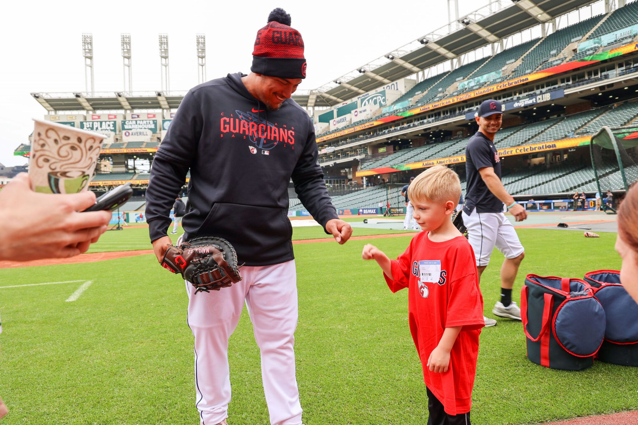 Josh Naylor baseball player fist bumps child