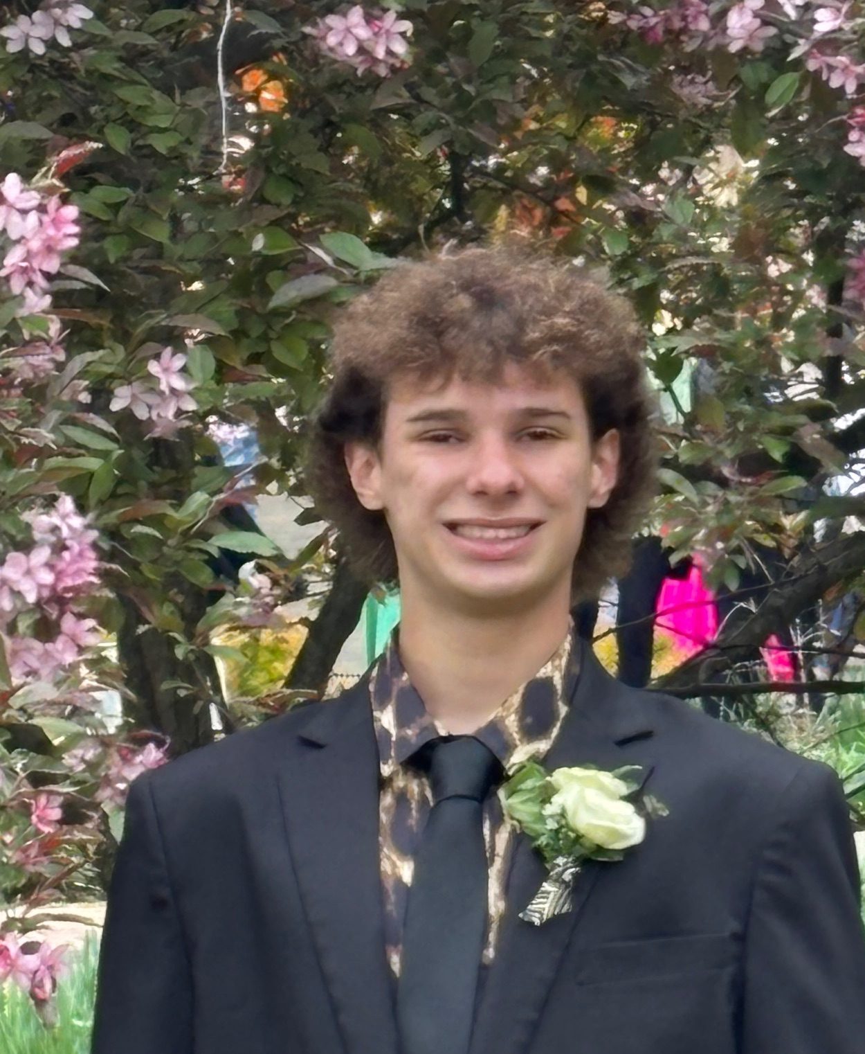 young man wearing suit smiling for camera