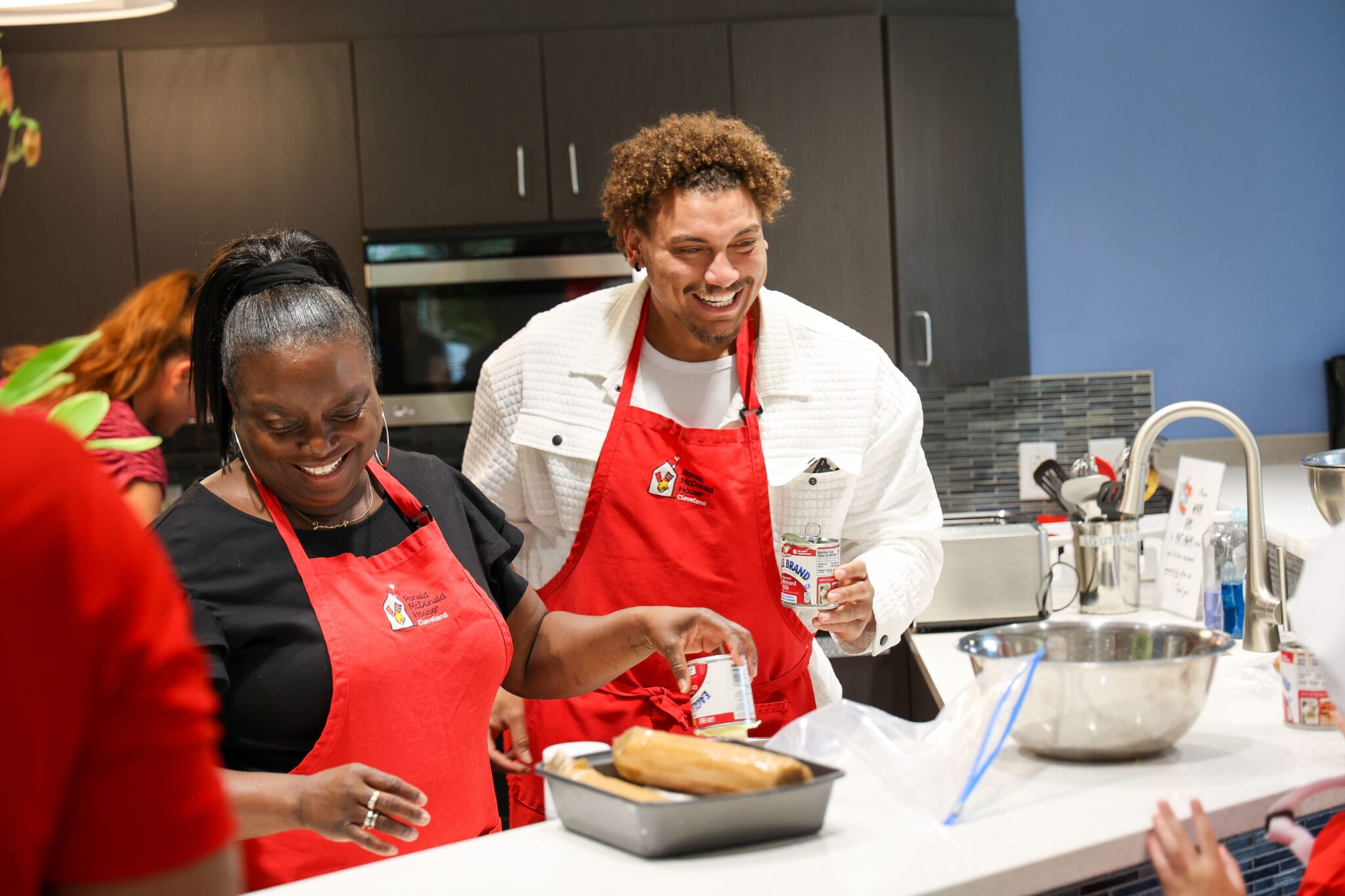 woman and man cooking