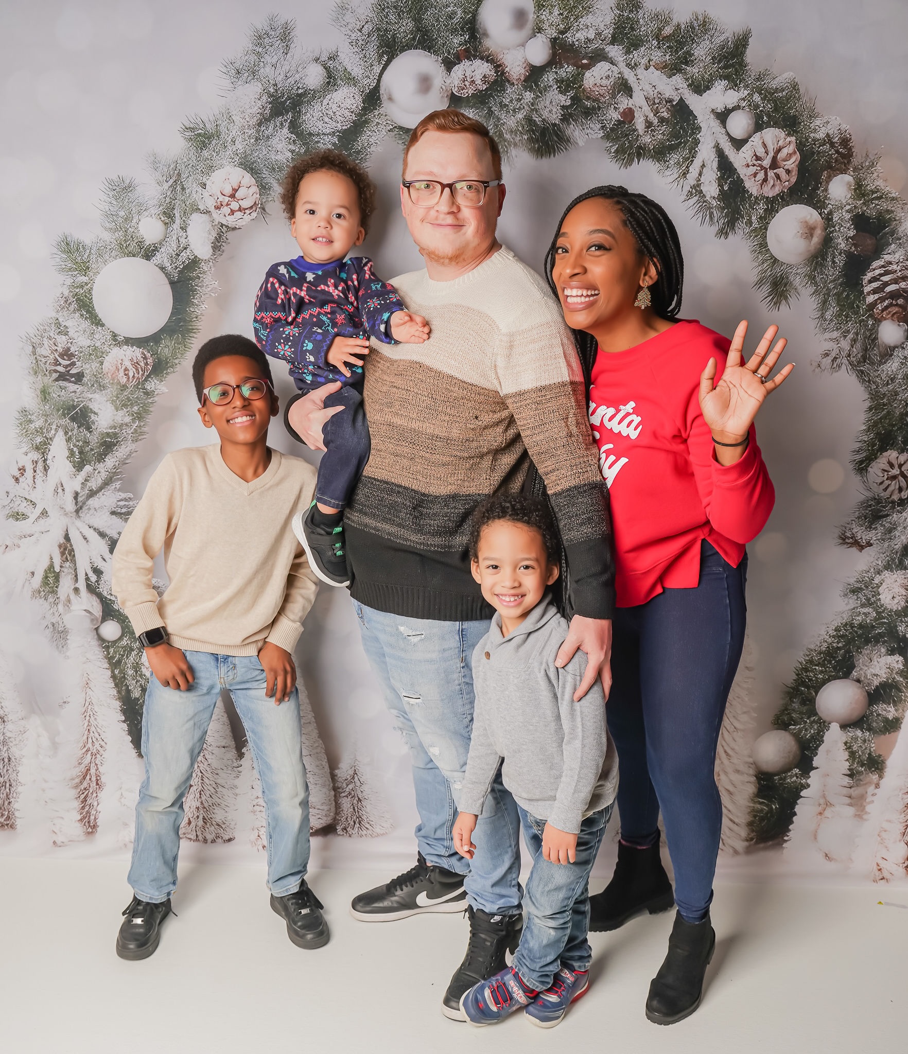 family photo of mom, dad, and three little boys