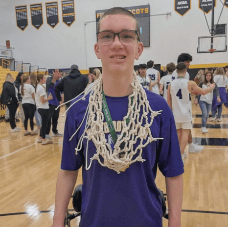 boy with basketball netaround neck